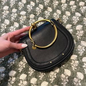 Black leather purse with gold hardware